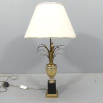 A mid-century Hollywood Regency style heavy brass pineapple design lamp on stepped metal base, in