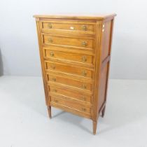 A French cherry wood semainier chest of 7 drawers. 61x112x35cm.