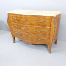 A French Louis XV style walnut veneered and satinwood strung bombe commode chest of three drawers,