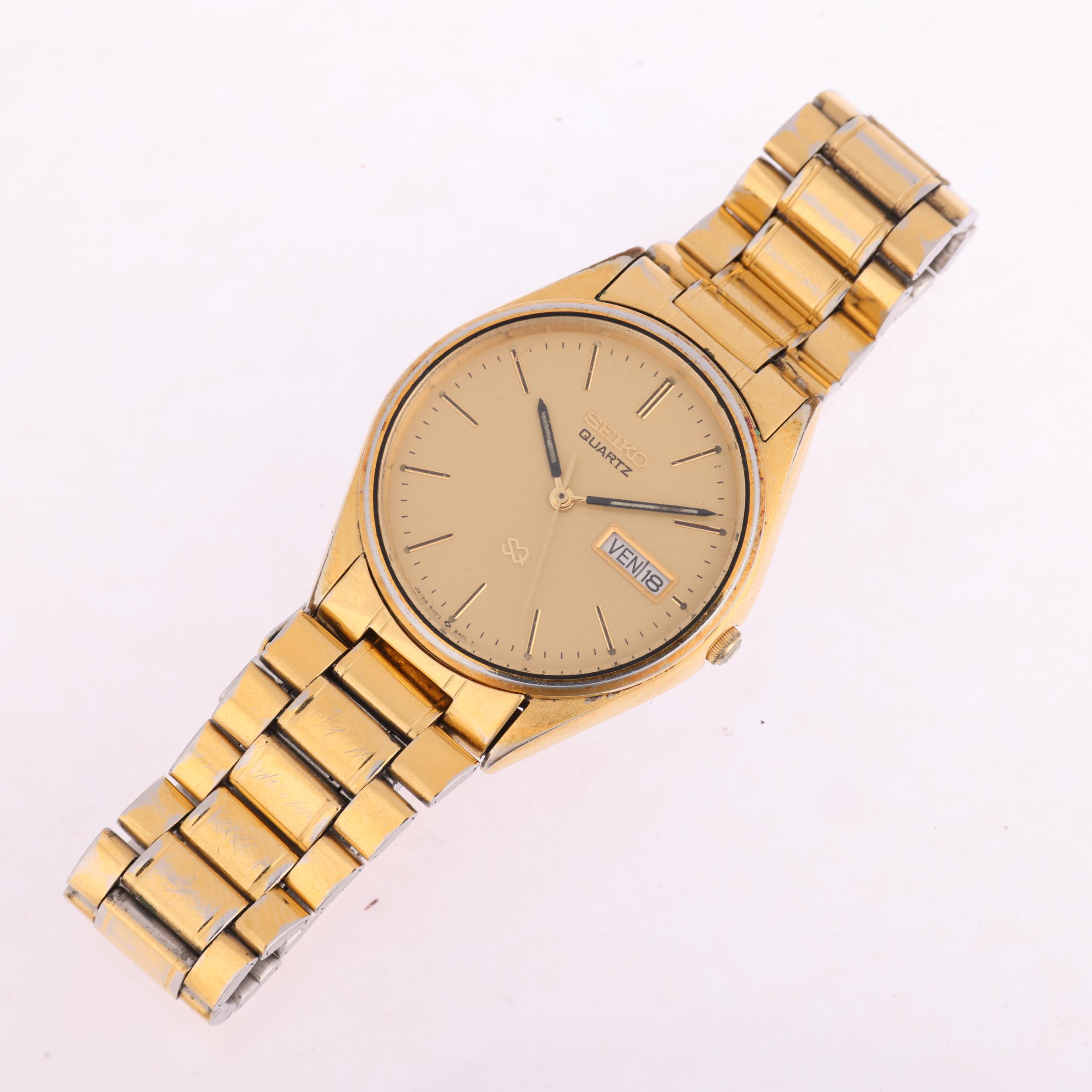 SEIKO - a gold plated stainless steel SQ quartz bracelet watch, ref. 5H23-8A00, champagne dial - Image 2 of 5