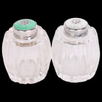HUGO GRUN - a pair of Danish sterling silver and coloured enamel mounted glass pepperette cruets,