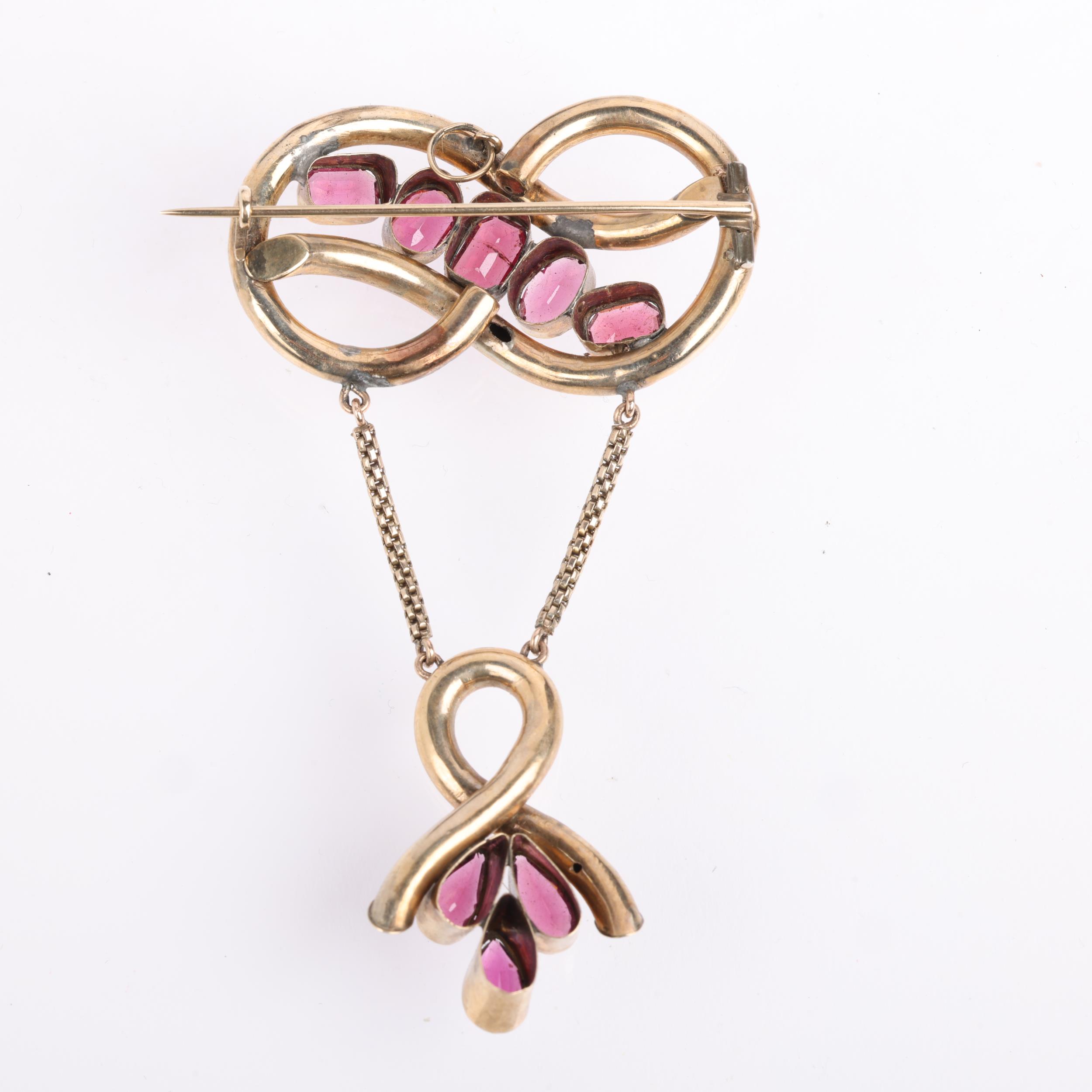 A large Victorian garnet knot drop brooch, circa 1860, set with vari-cut garnets, apparently - Image 3 of 4