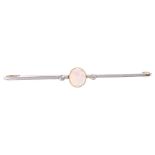 An Edwardian 15ct rose gold opal and diamond bar brooch, platinum-topped set with oval cabochon opal