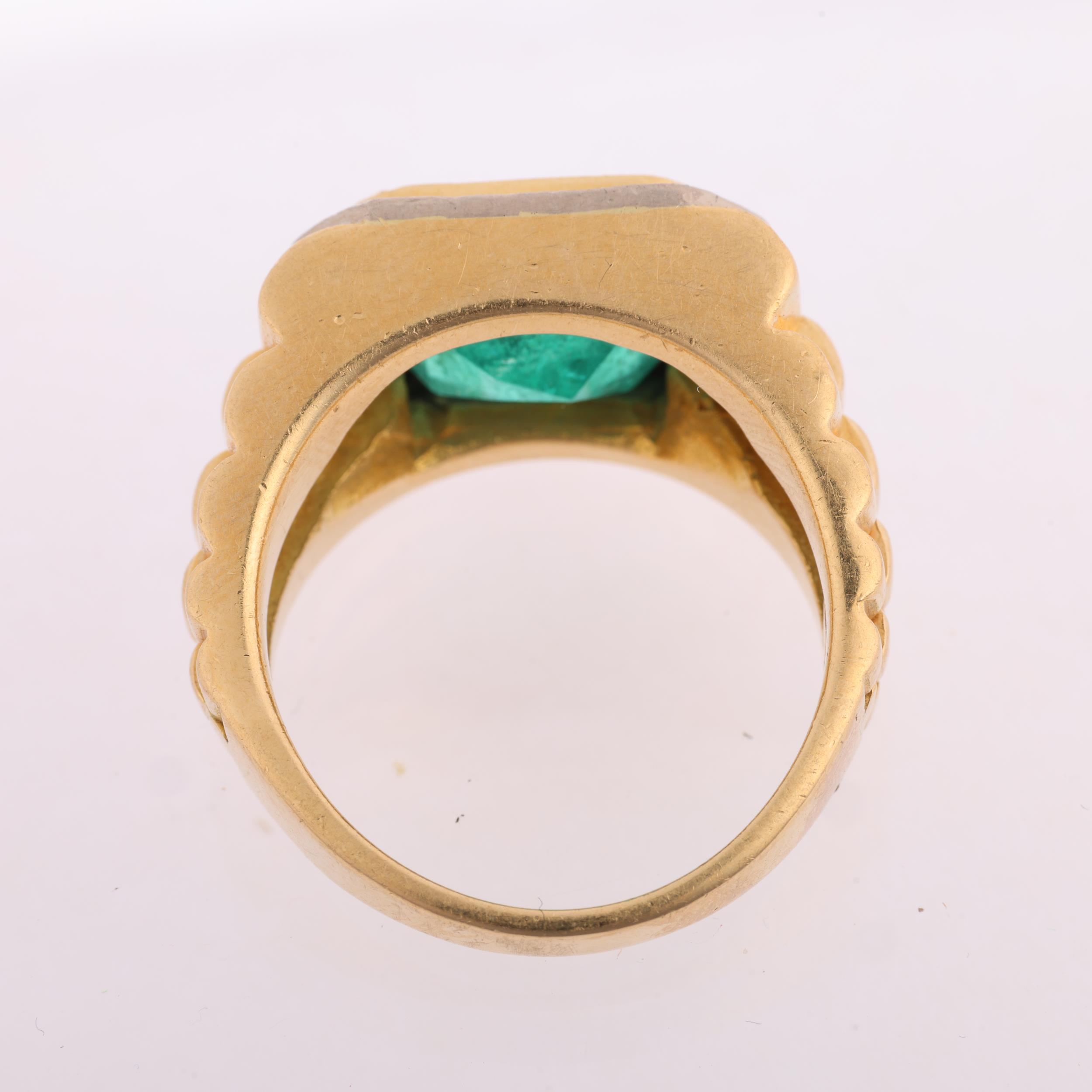 A large 18ct gold emerald and diamond cluster ring, rub-over set with 6.8ct octagonal step-cut - Image 3 of 4