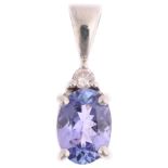 A modern 9ct white gold tanzanite and diamond pendant, 15.1mm, 0.8g Condition Report: No damage or