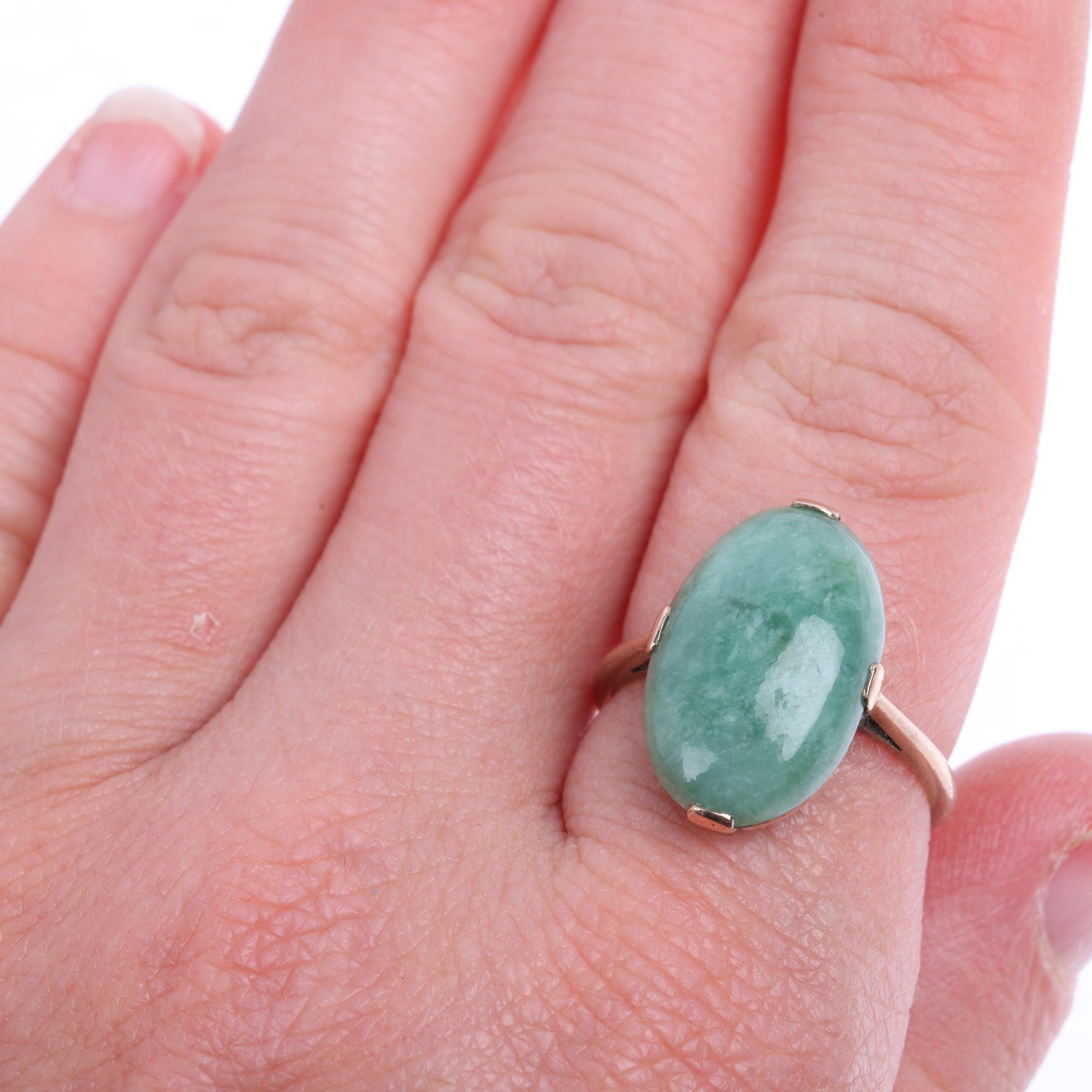 A late 20th century jadeite panel ring, claw set with oval cabochon jadeite, apparently unmarked, - Image 4 of 4