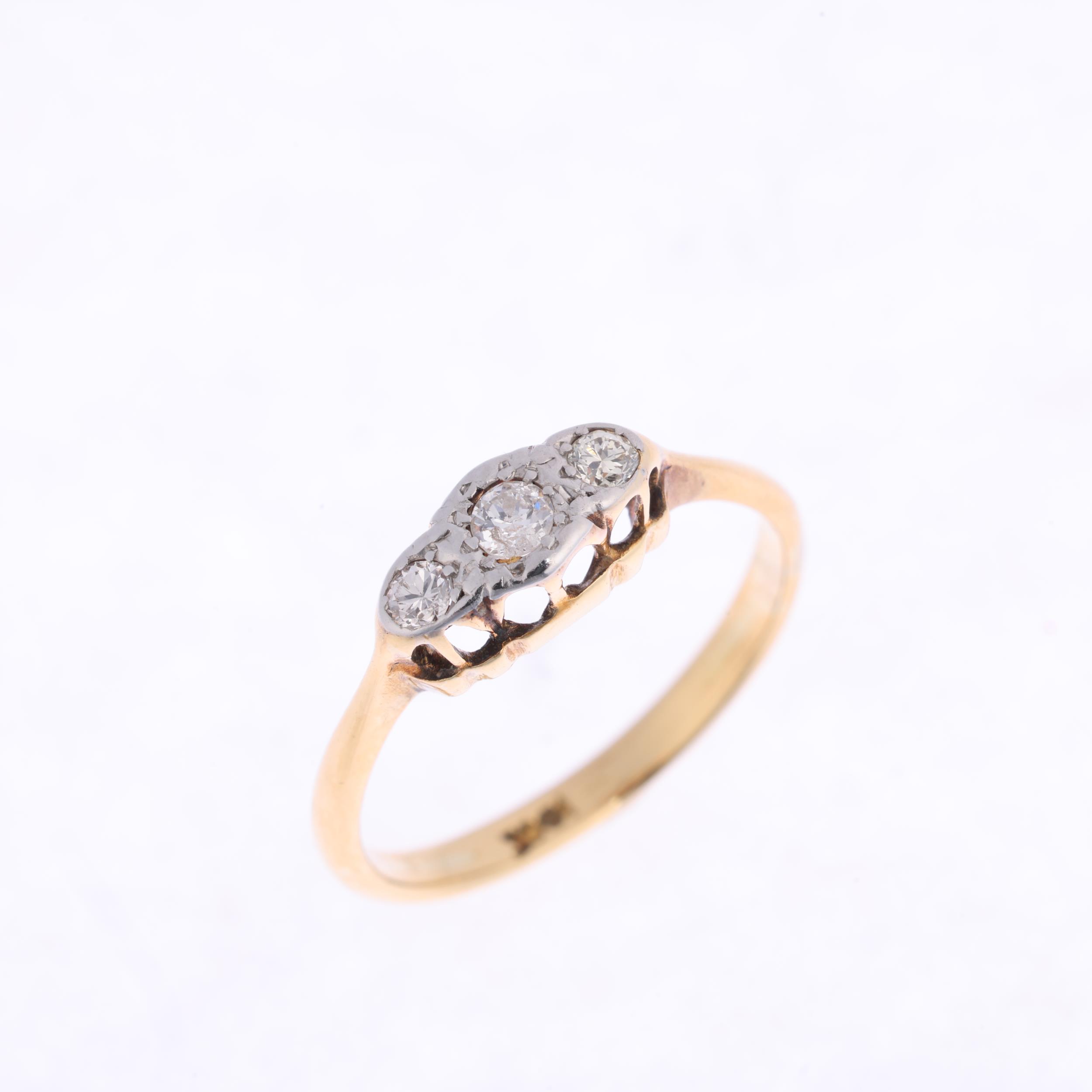 An 18ct gold three stone diamond ring, platinum-topped set with round brilliant-cut diamonds, - Image 2 of 4