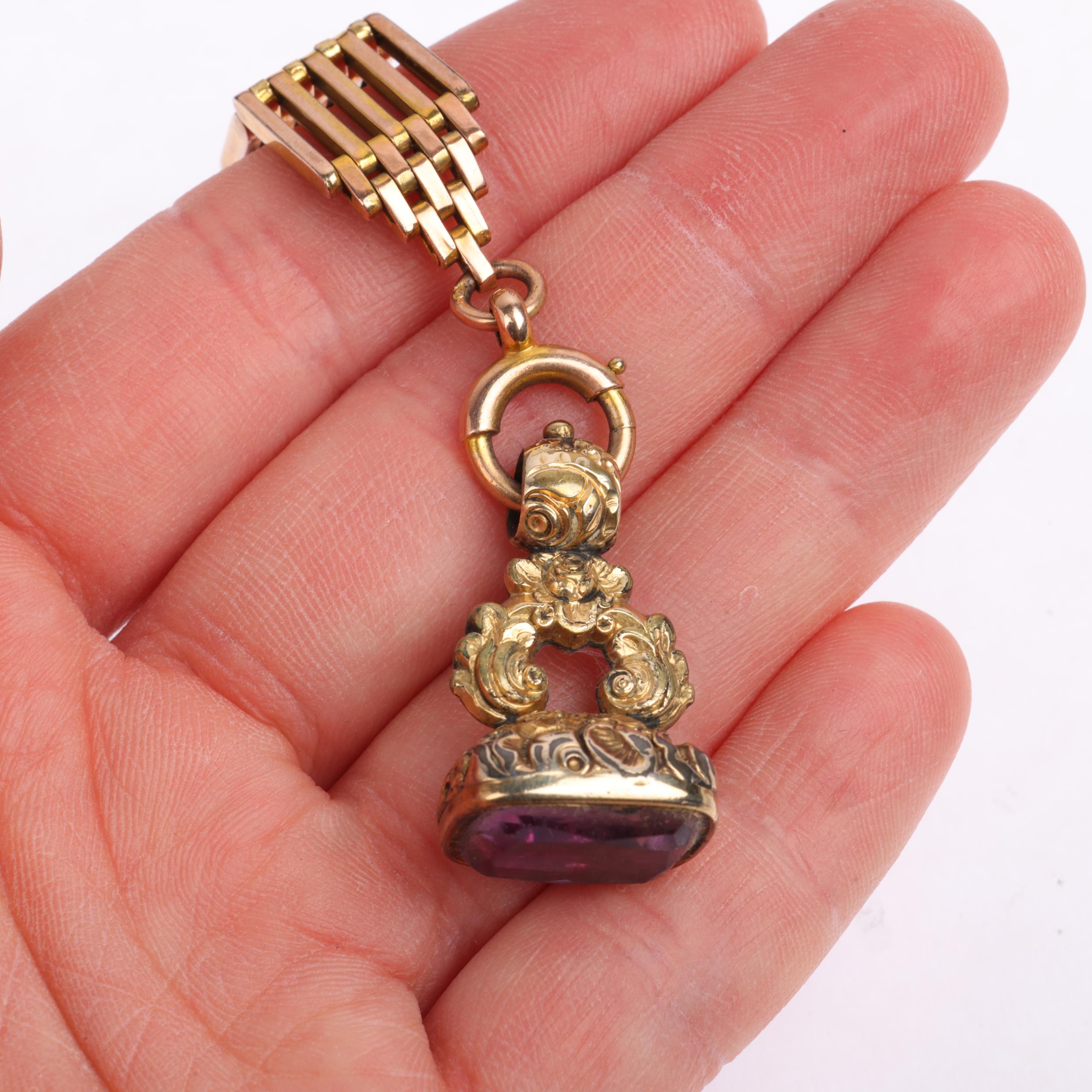 An Antique 9ct rose gold short gatelink fob chain, with gilt-metal fob and unmarked yellow metal dog - Image 4 of 4