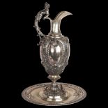 A large and impressive Italian 800 silver Rococo Revival wine ewer and stand, with Bacchanalian