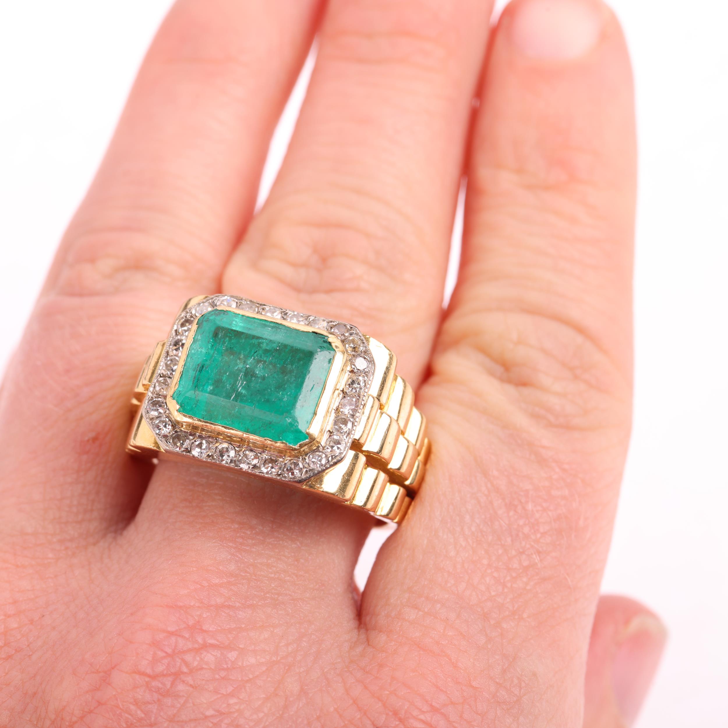 A large 18ct gold emerald and diamond cluster ring, rub-over set with 6.8ct octagonal step-cut - Image 4 of 4