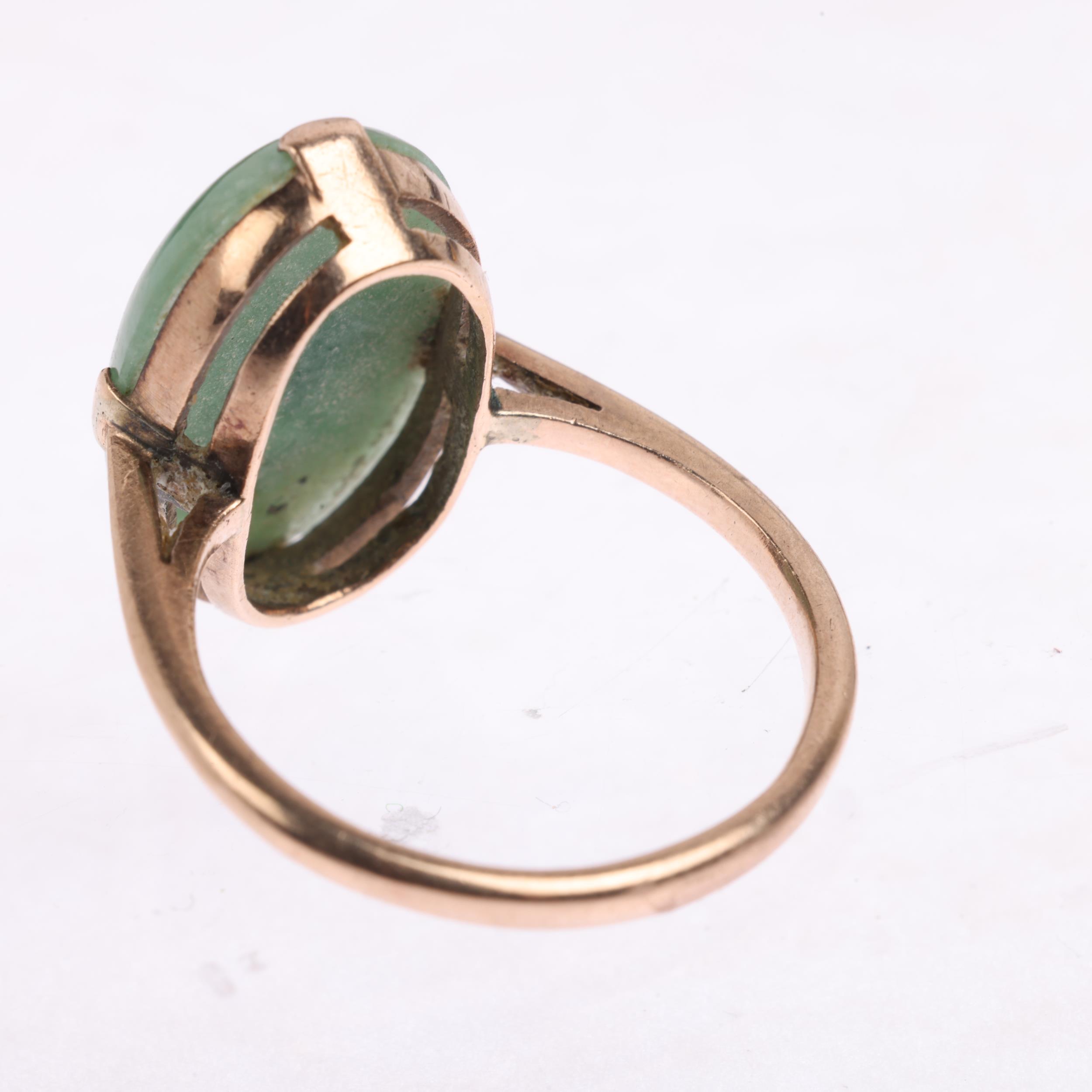 A late 20th century jadeite panel ring, claw set with oval cabochon jadeite, apparently unmarked, - Image 3 of 4