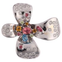 An 18ct white gold gem set flowerhead brooch, unsigned, set with pink tourmaline blue topaz