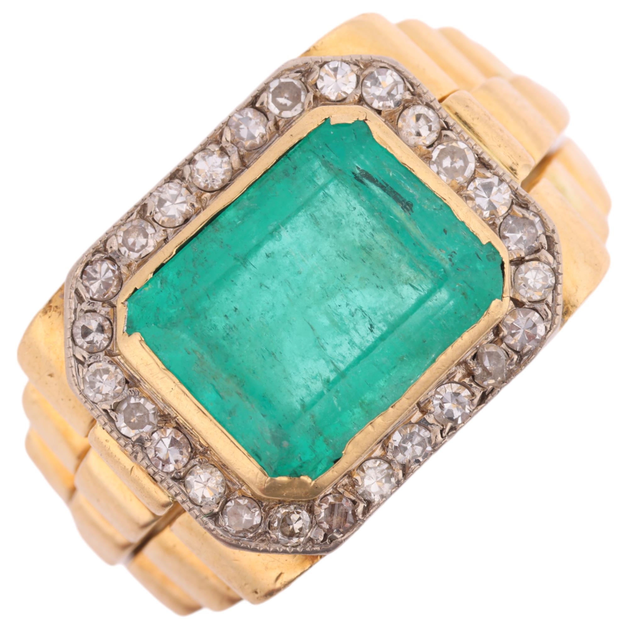 A large 18ct gold emerald and diamond cluster ring, rub-over set with 6.8ct octagonal step-cut