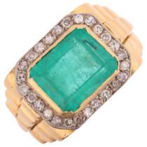A large 18ct gold emerald and diamond cluster ring, rub-over set with 6.8ct octagonal step-cut