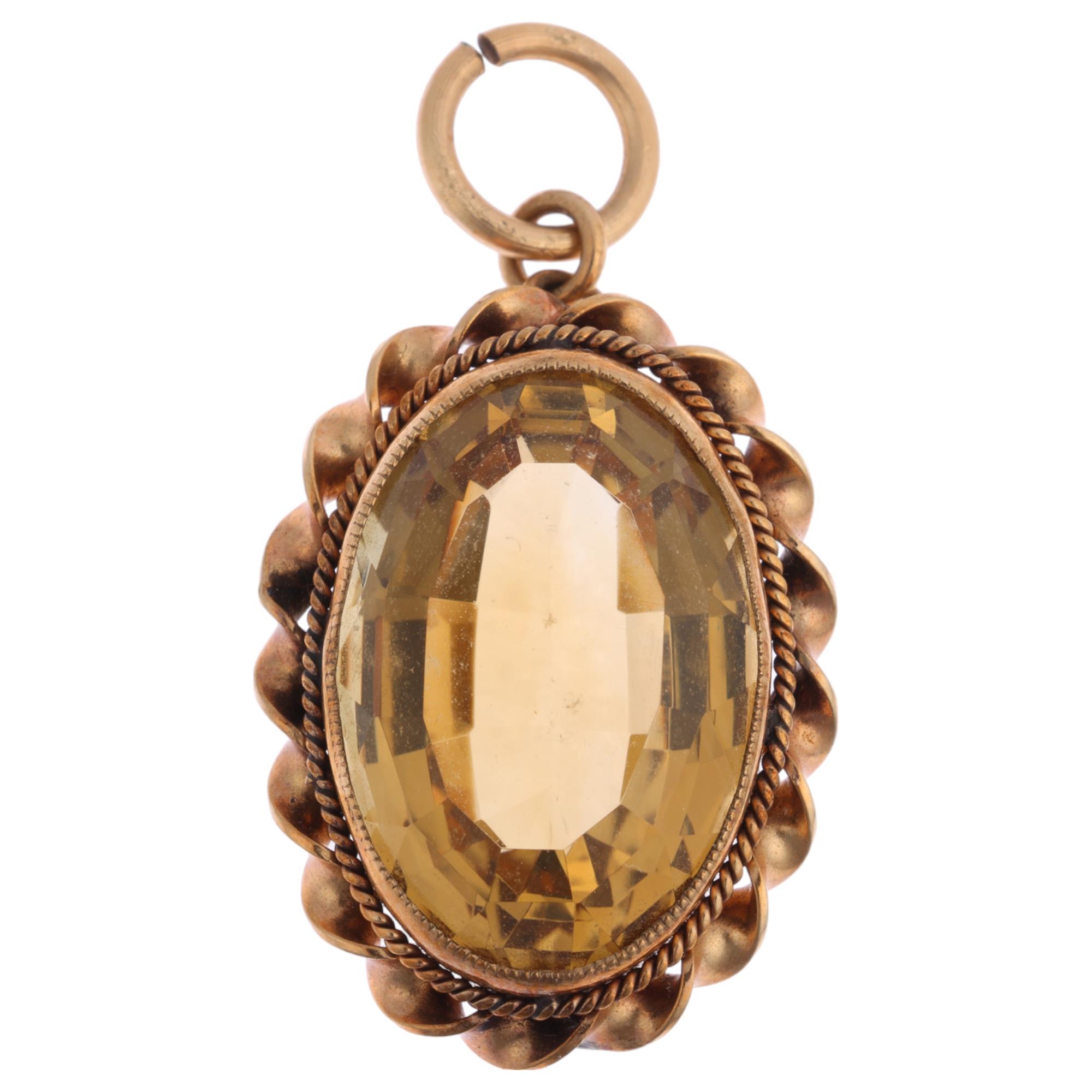 A 9ct gold citrine pendant, maker DJE, Edinburgh 1962, rub-over set with oval step-cut citrine