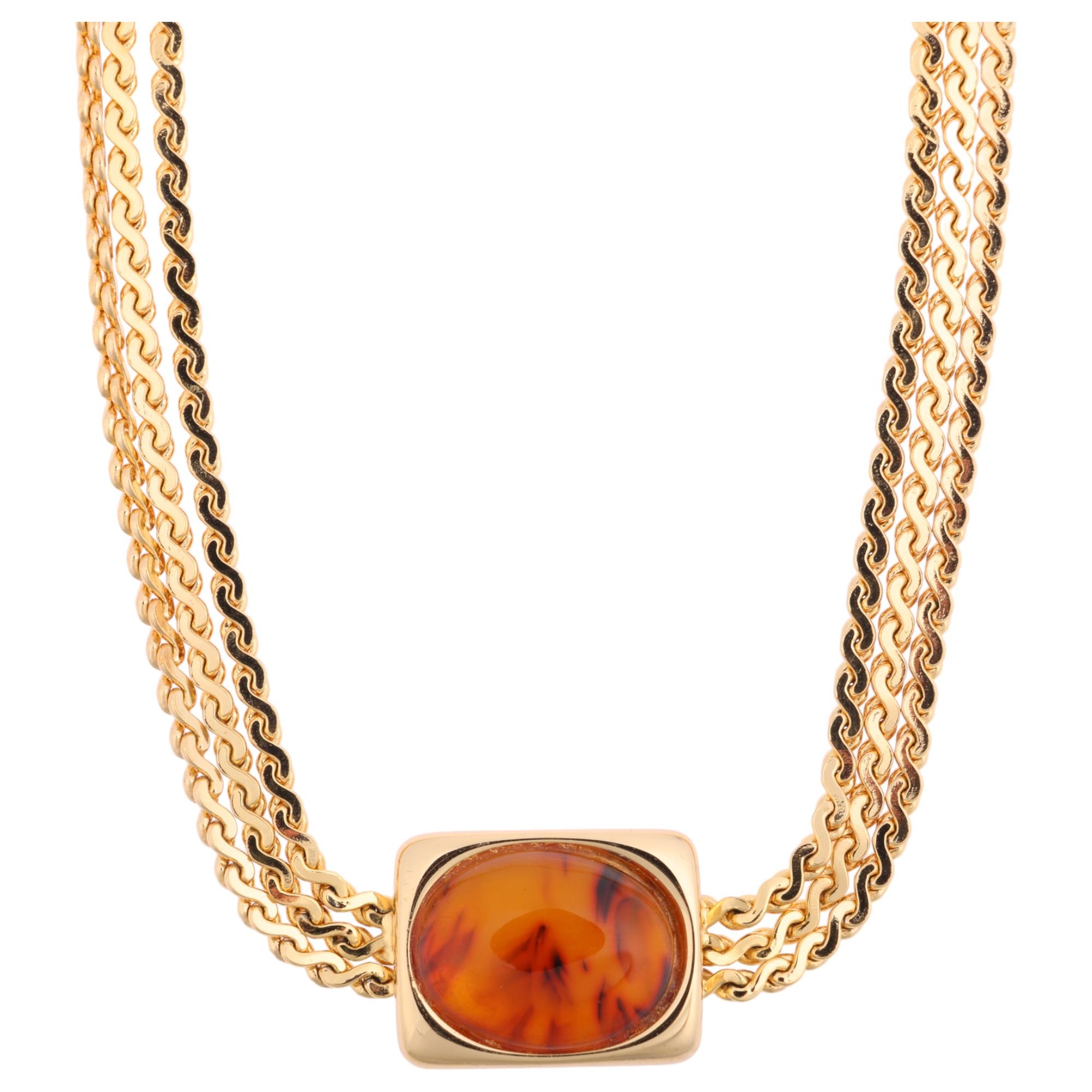 CHRISTIAN DIOR - a Vintage gold plated Bakelite necklace, on multi-strand serpentine link chain,