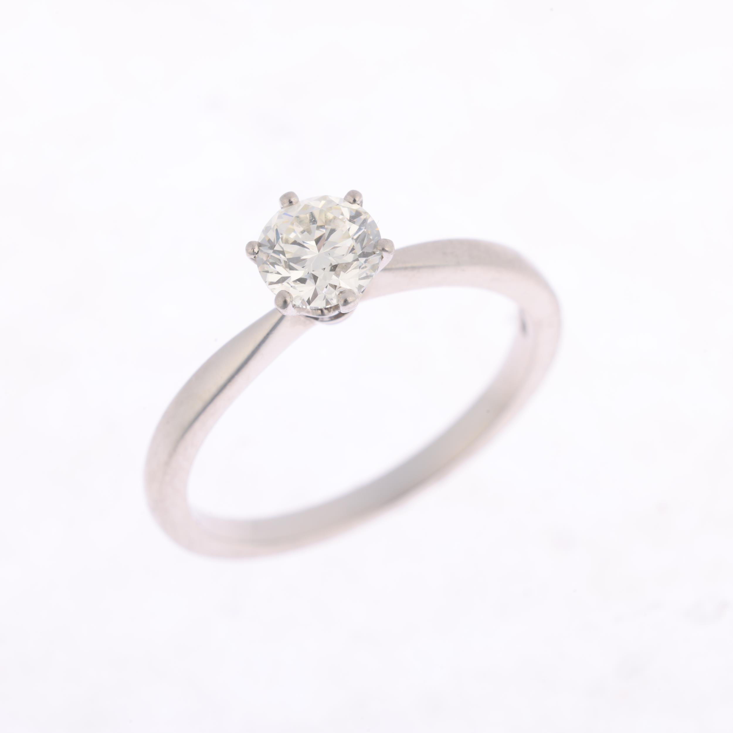 A platinum 0.7ct solitaire diamond ring, 6-claw set with modern round brilliant-cut diamond, - Image 2 of 4