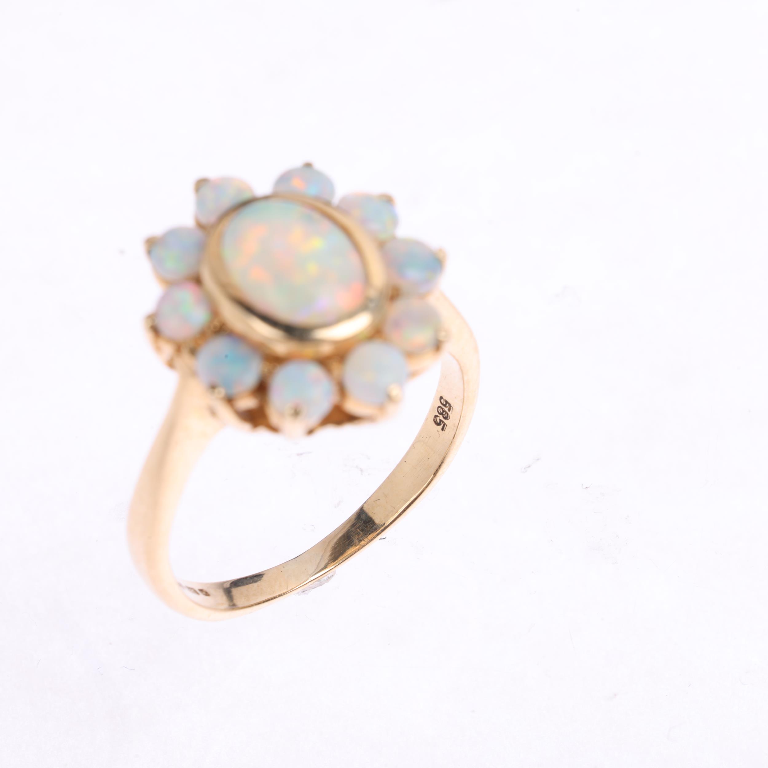 A 14ct gold opal flowerhead cluster ring, set with oval and round cabochon opals, setting height - Image 3 of 4