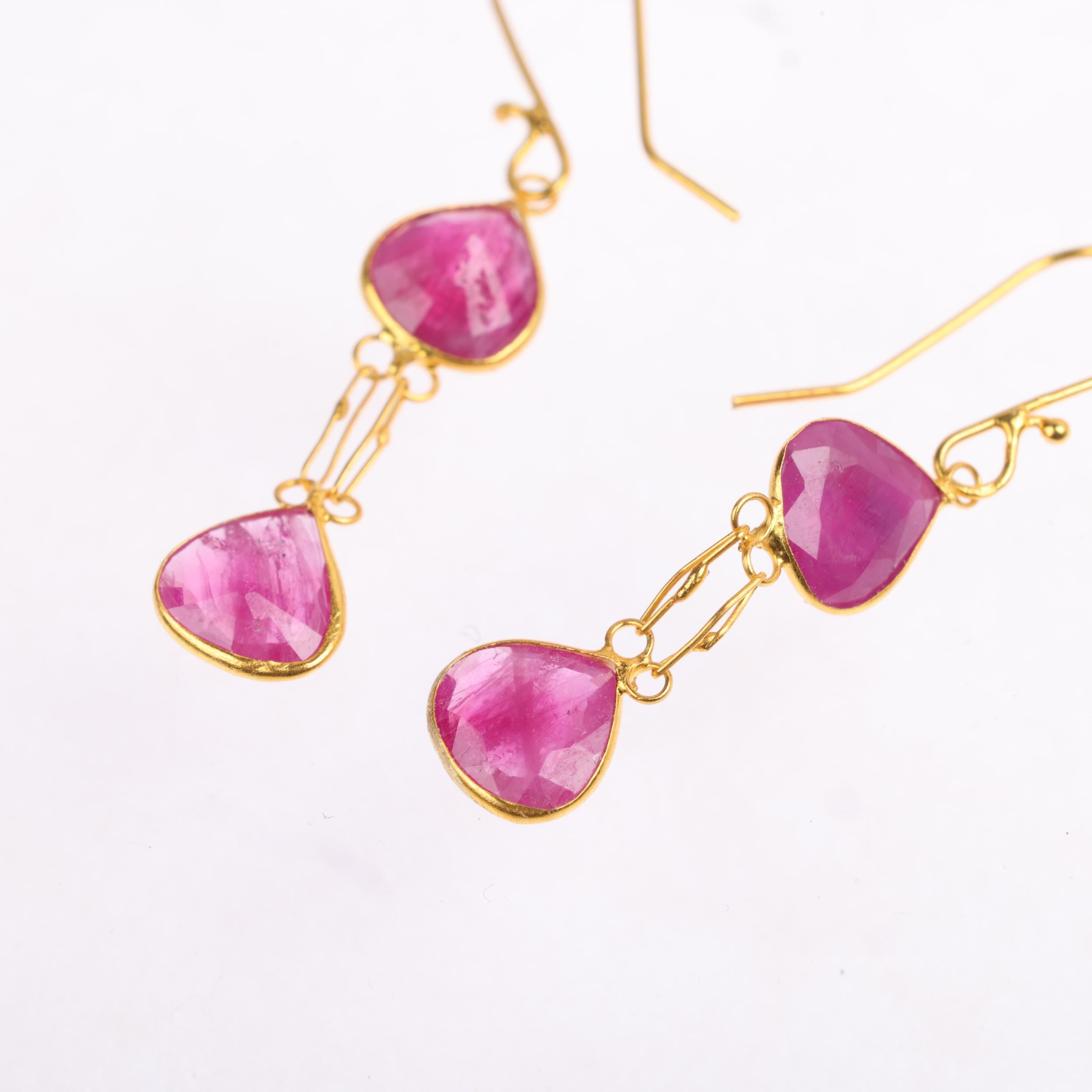 A pair of 18ct gold ruby drop earrings, set with pear-cut rubies, and shepherd hook fittings, 27. - Image 3 of 4