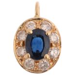 A modern sapphire and diamond oval cluster pendant, claw set with oval mixed-cut sapphire and modern