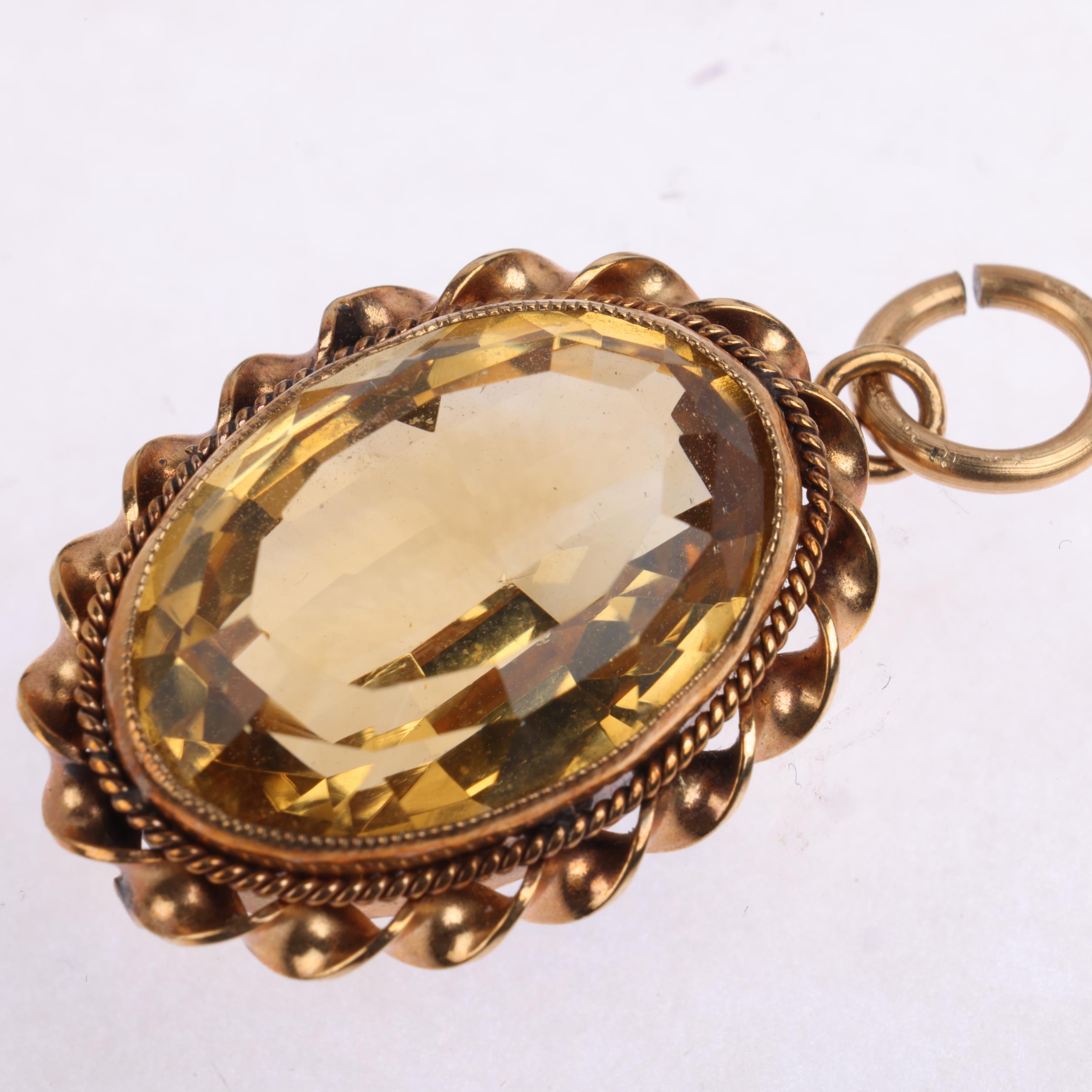A 9ct gold citrine pendant, maker DJE, Edinburgh 1962, rub-over set with oval step-cut citrine - Image 3 of 4
