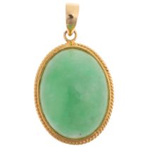 A Chinese 14ct gold jade pendant, set with oval cabochon jade, 26.2mm, 2.1g Condition Report: No
