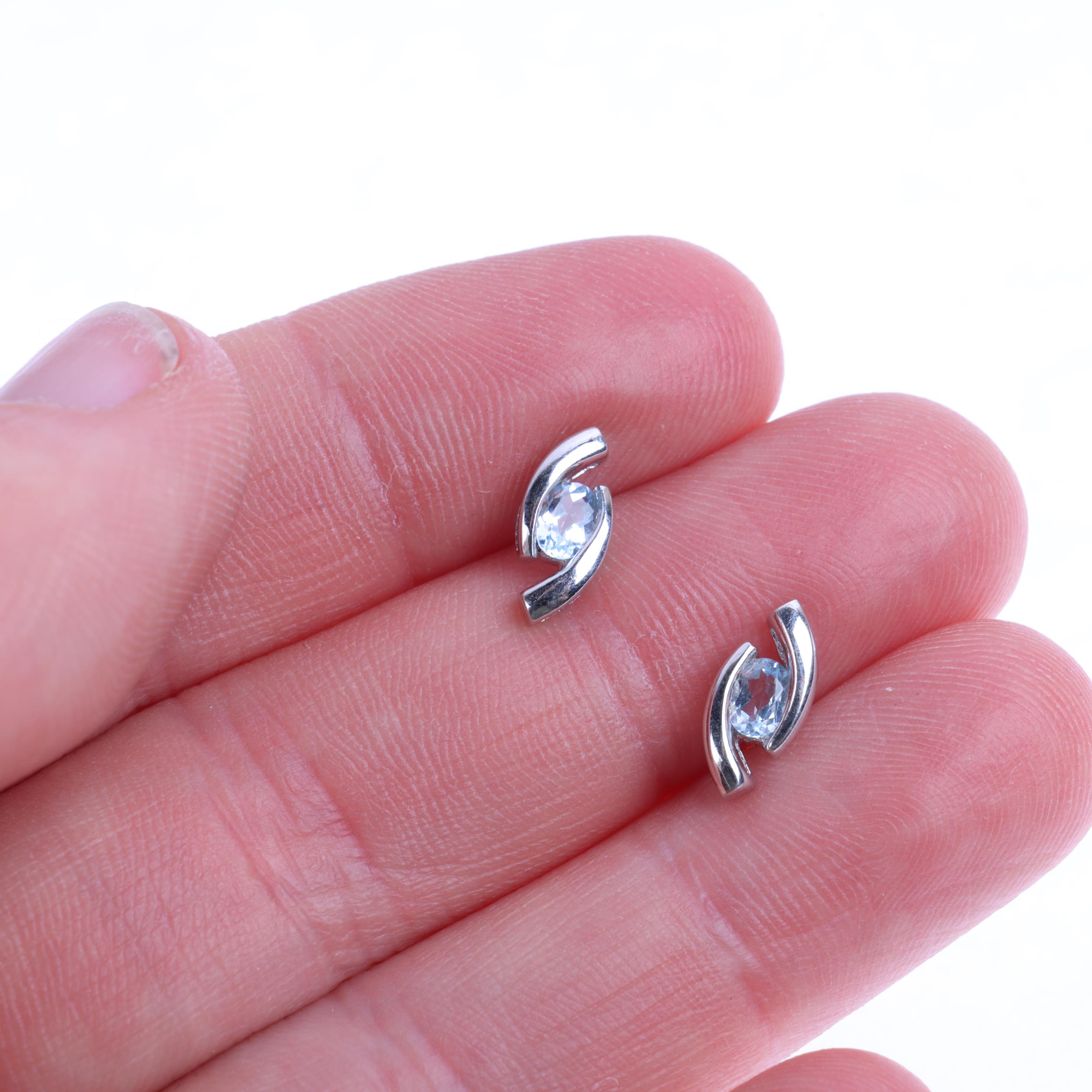 A pair of 9ct white gold blue topaz earrings, with stud fittings, 10.8mm, 1.4g Condition Report: - Image 4 of 4