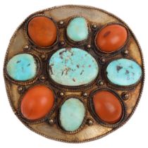 A large Tibetan turquoise and coral panel brooch, unmarked gilt-metal settings, 58.6mm, 27.5g