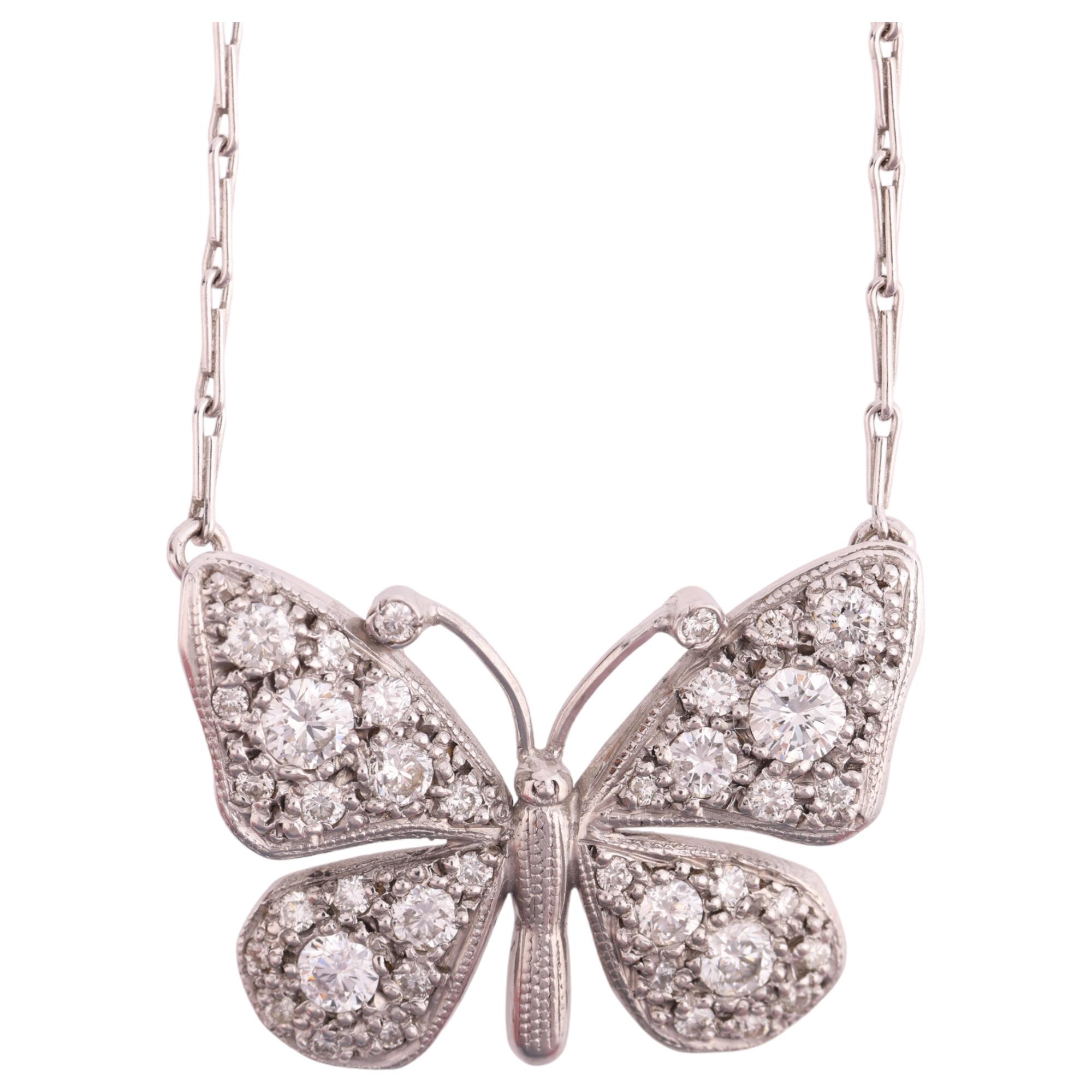 An 18ct white gold diamond butterfly pendant necklace, by Peter Farrow, pave set with modern round