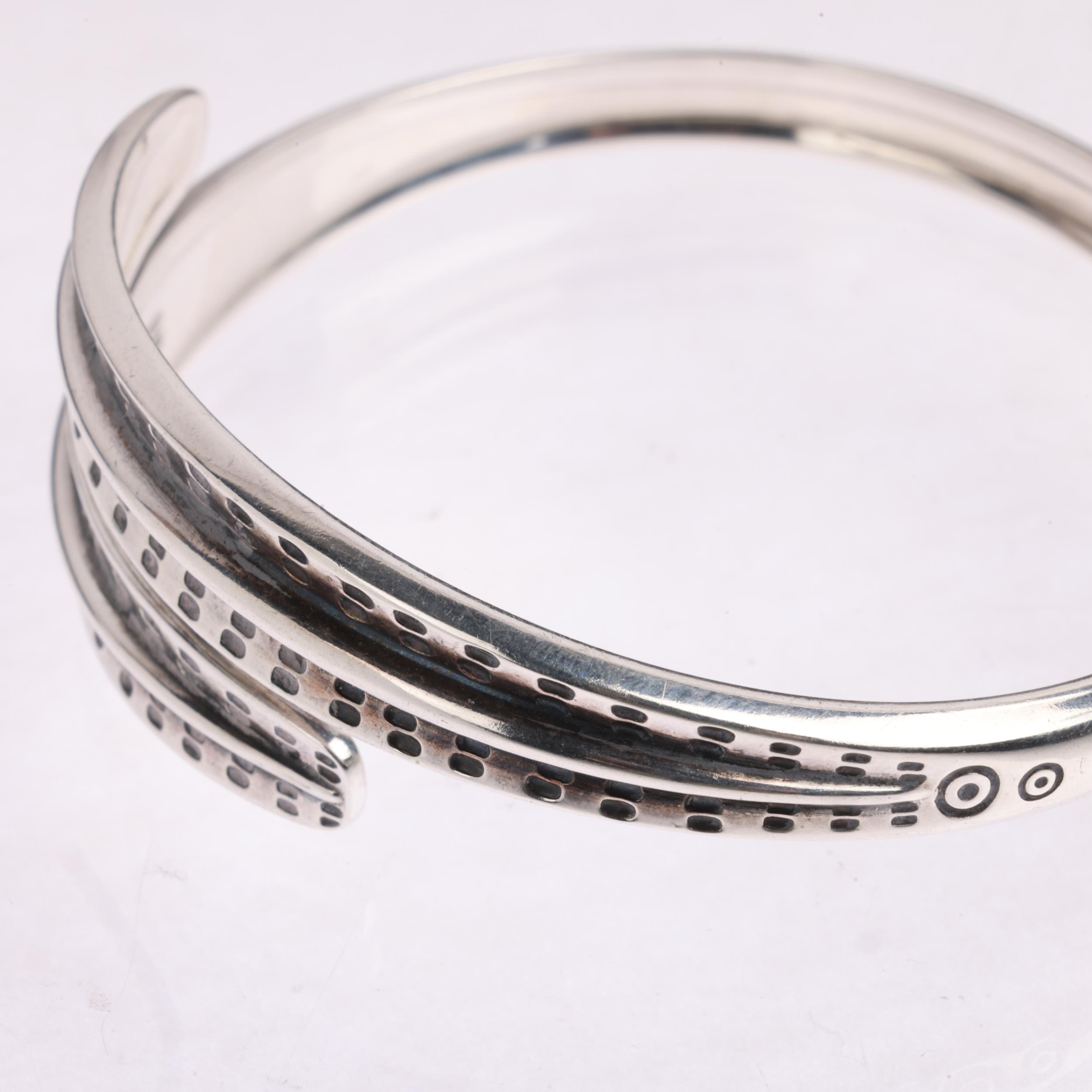 DAVID ANDERSEN - a Norwegian sterling silver Viking Revival torque bangle, a copy of original from - Image 2 of 3