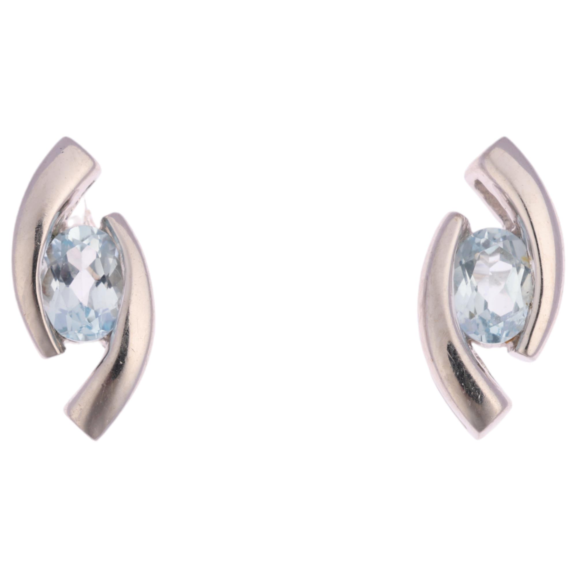 A pair of 9ct white gold blue topaz earrings, with stud fittings, 10.8mm, 1.4g Condition Report:
