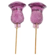 A pair of amethyst coloured glass thistle hatpins, 17cm, 12.8g Condition Report: A few tiny edge
