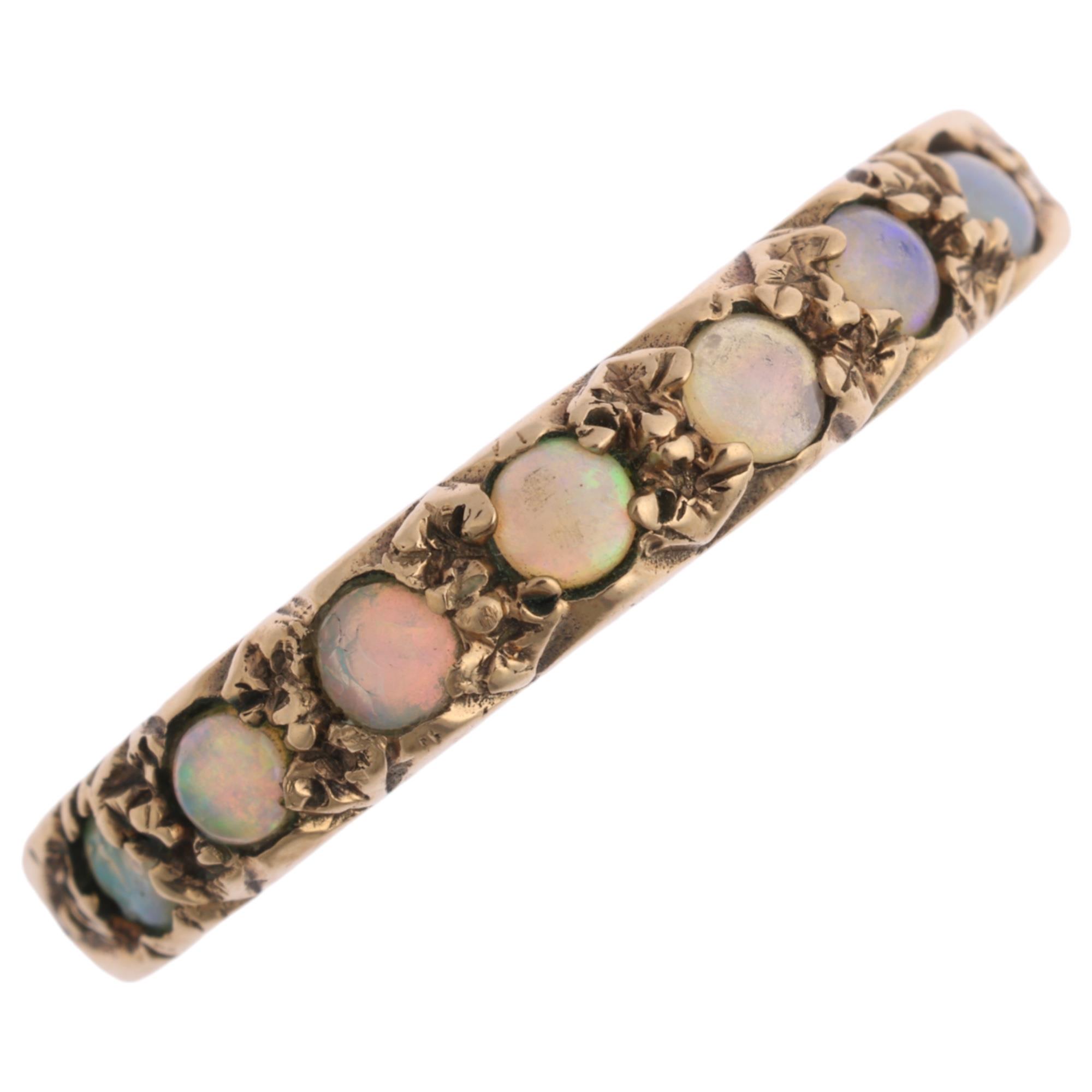 A 9ct gold opal half eternity ring, maker S&K, London 1959, set with round cabochon opals, setting