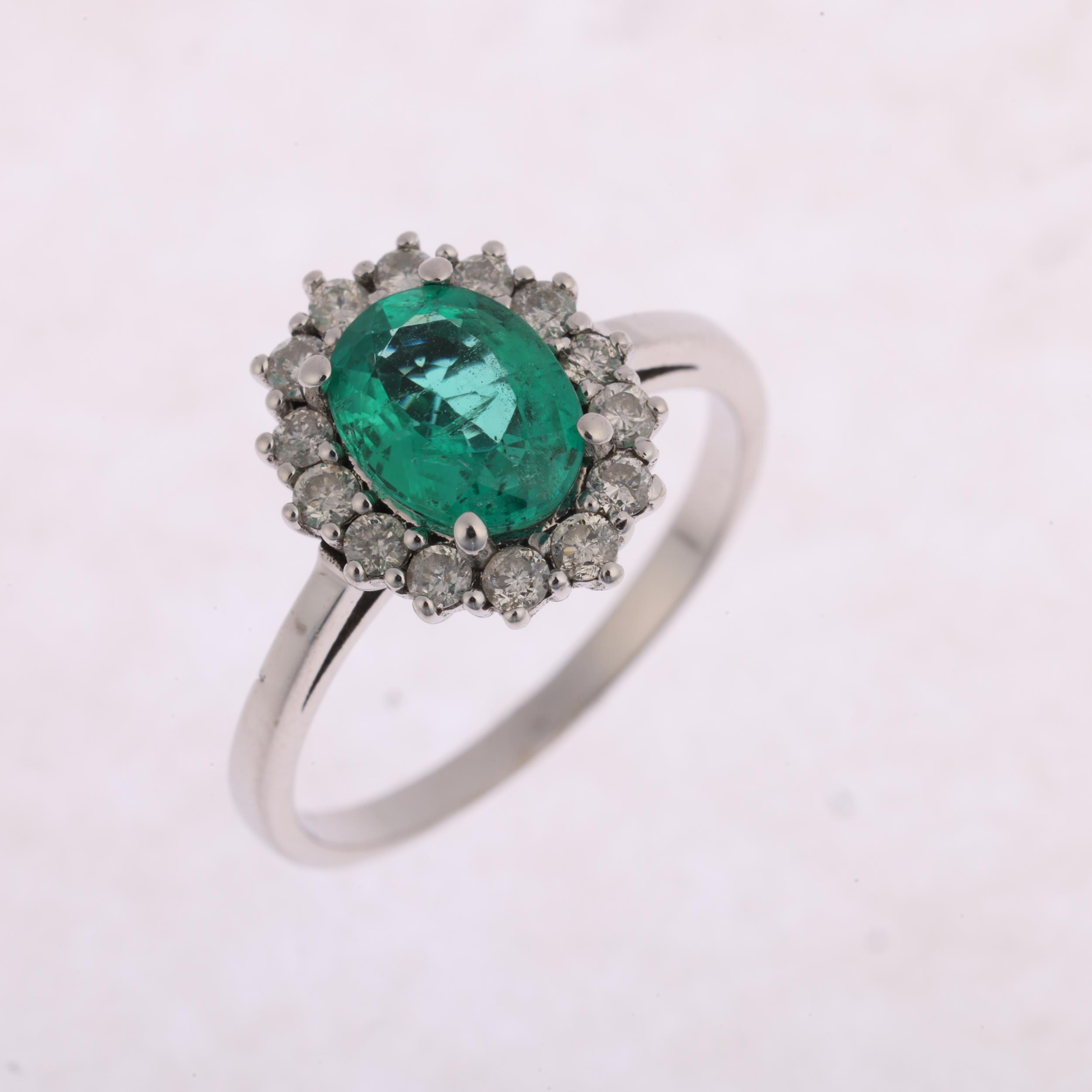 An emerald and diamond oval cluster ring, claw set with oval mixed-cut emerald and modern round - Image 2 of 4