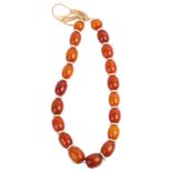 A single-strand Bakelite bead necklace, beads measure 19mm, necklace 34cm, 48.2g Condition Report: