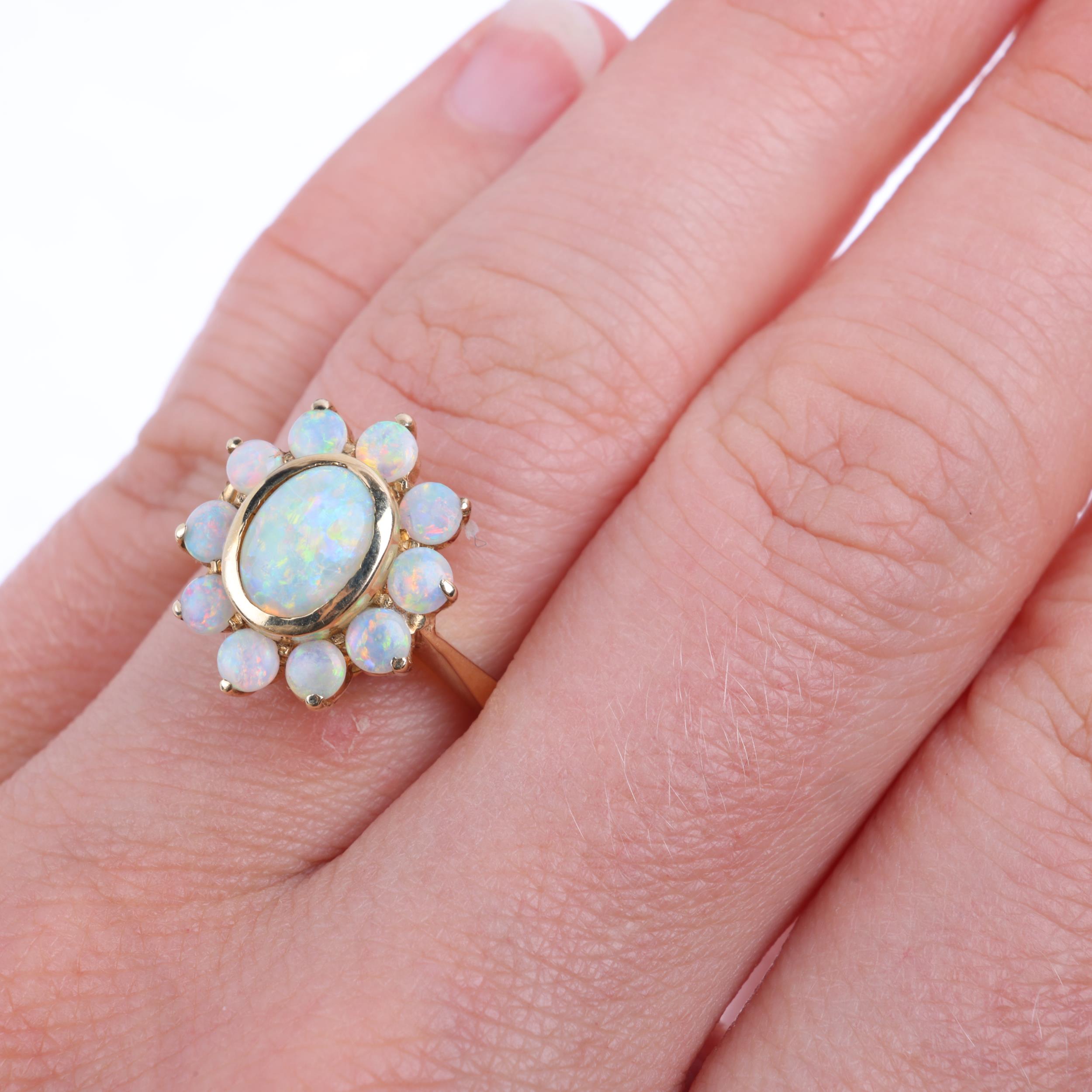 A 14ct gold opal flowerhead cluster ring, set with oval and round cabochon opals, setting height - Image 4 of 4