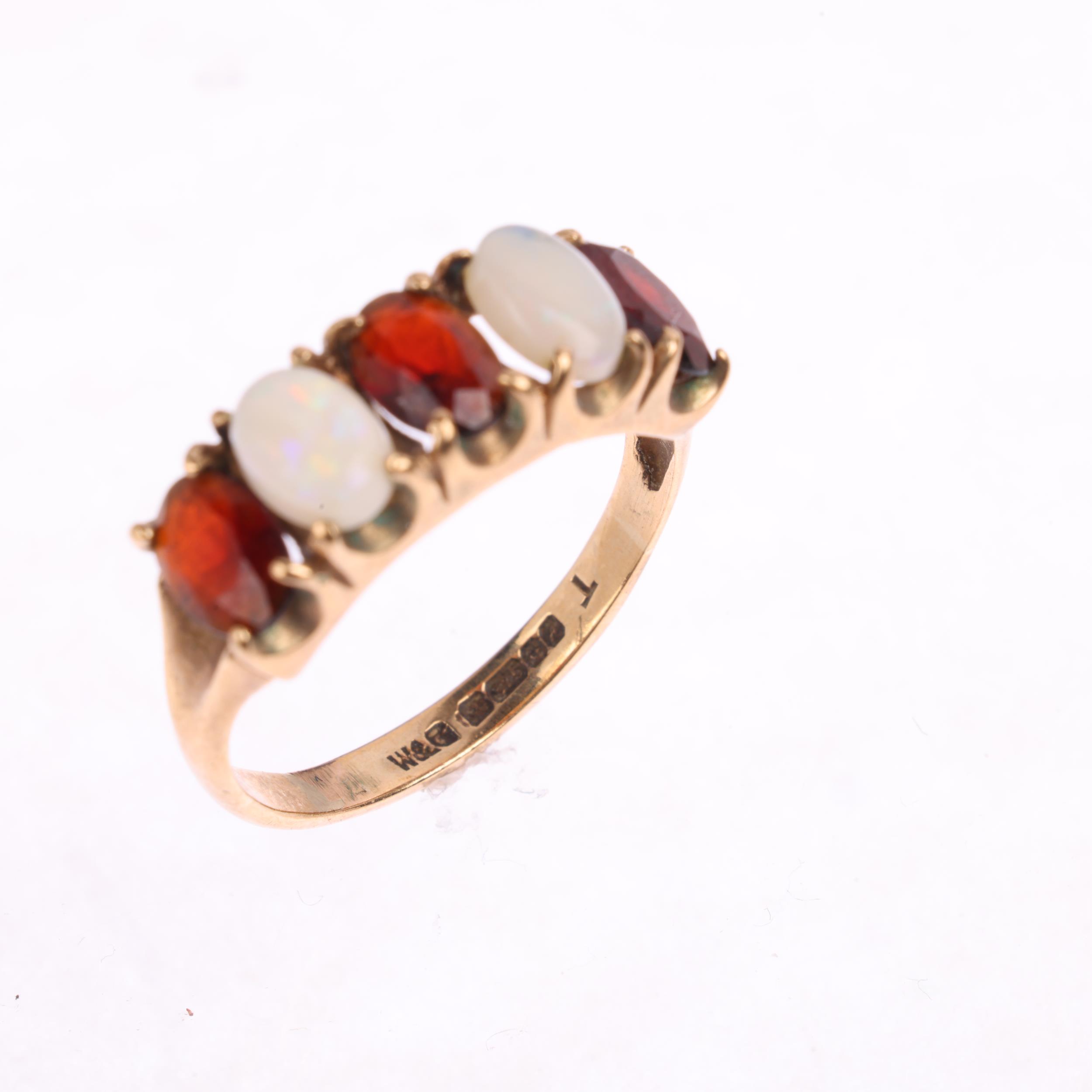 A 9ct gold five stone opal and garnet half hoop ring, maker W&G, Birmingham 1975, setting height 6. - Image 2 of 4