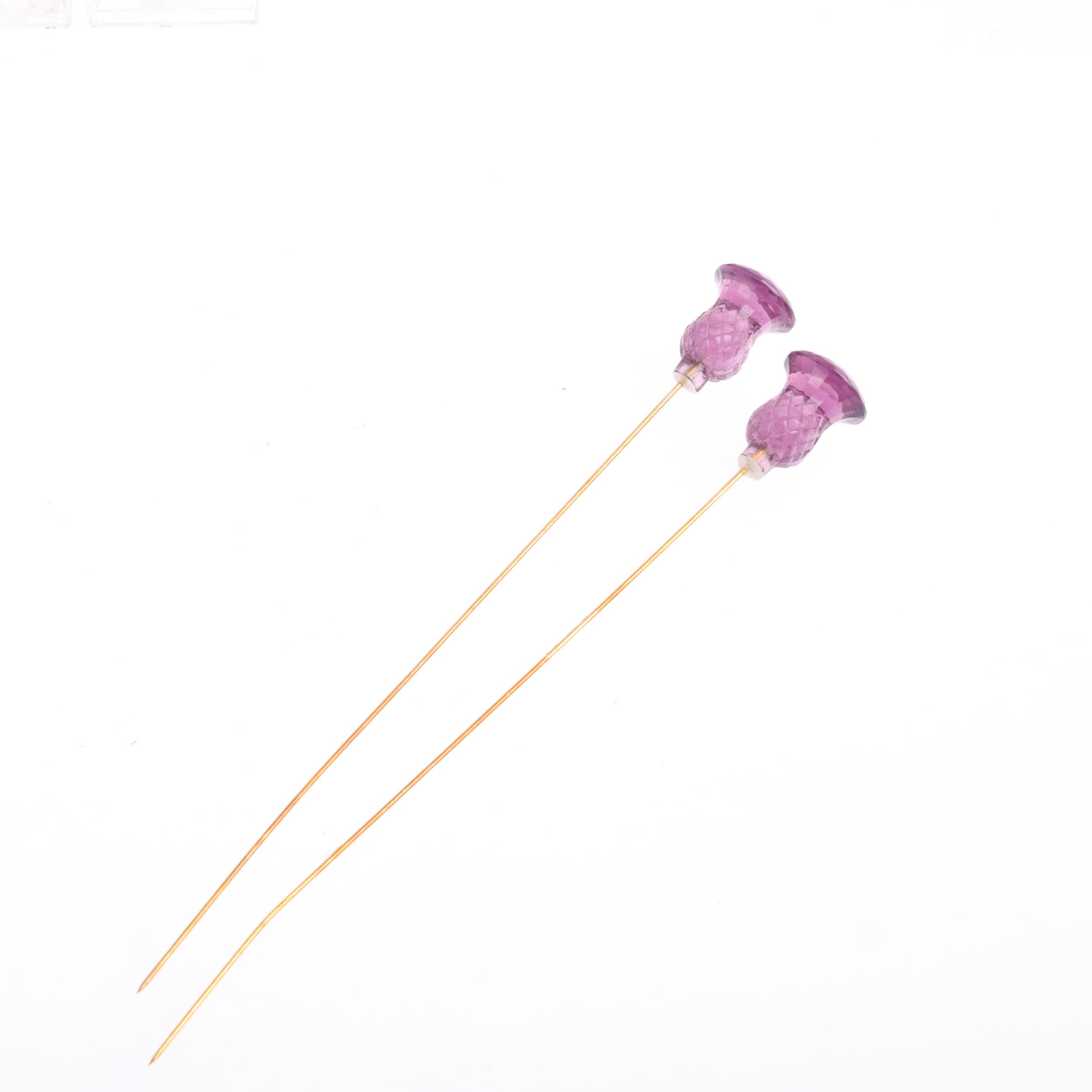 A pair of amethyst coloured glass thistle hatpins, 17cm, 12.8g Condition Report: A few tiny edge - Image 2 of 3