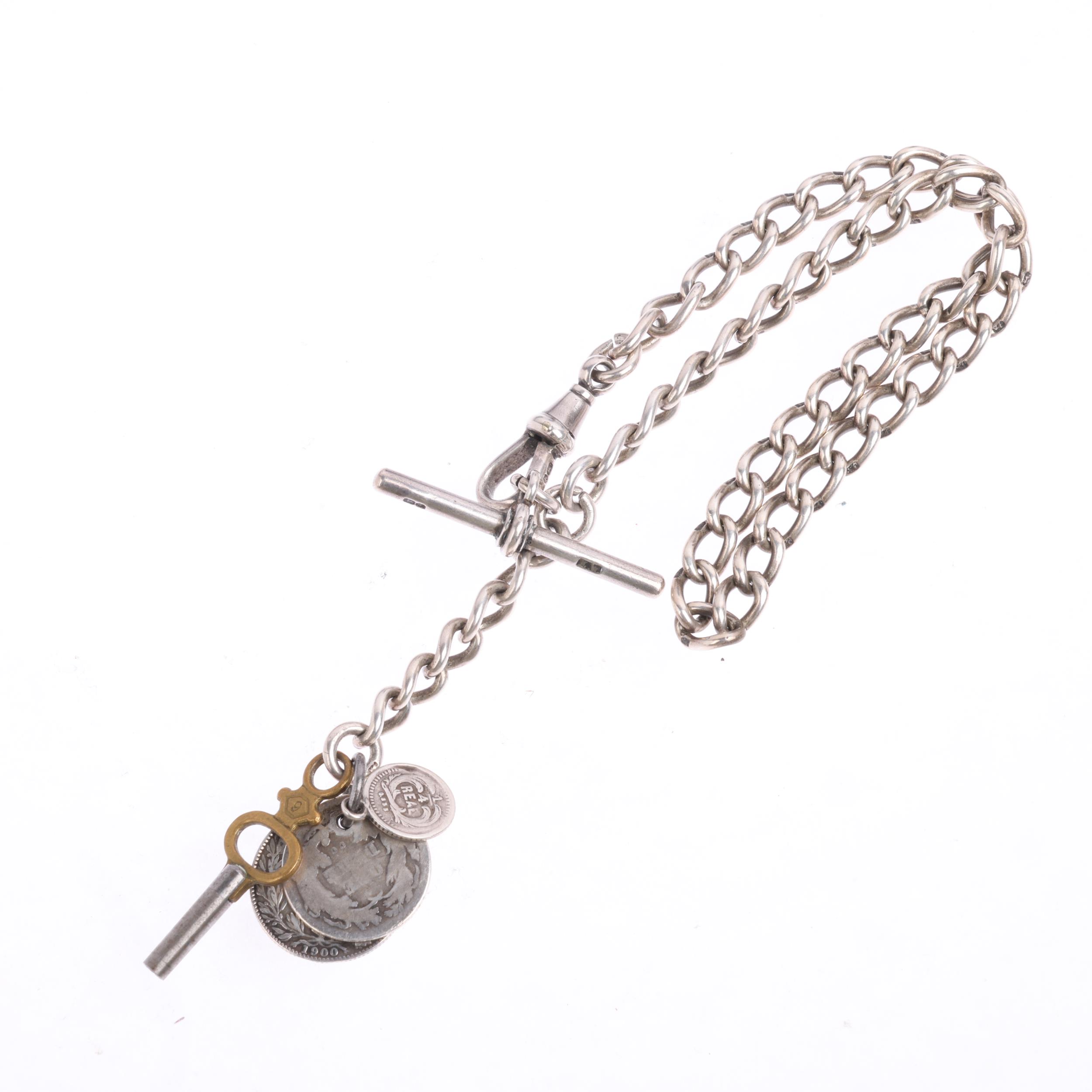 An early 20th century silver solid curb link Albert chain necklace, with dog clip T-bar and coin - Image 2 of 3