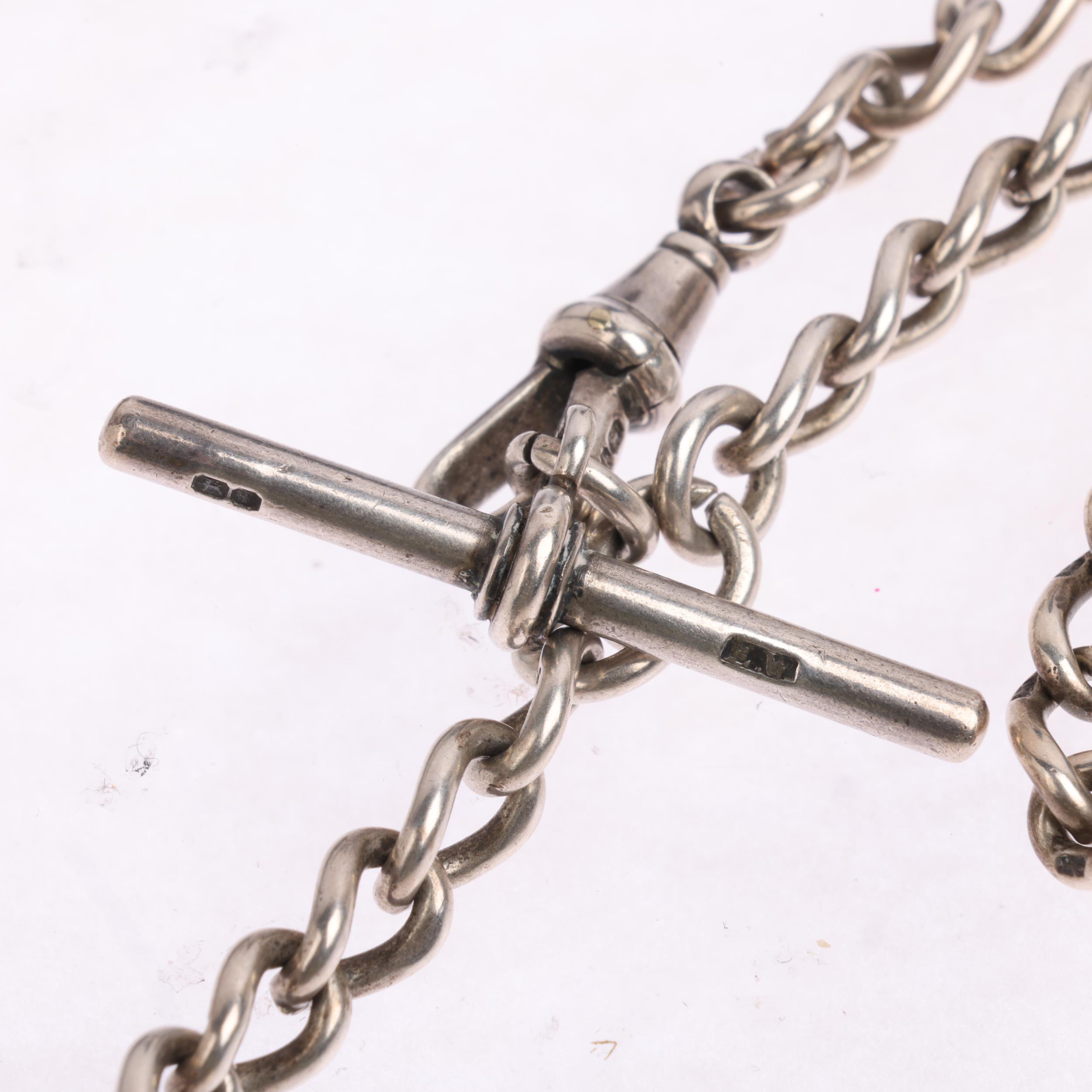 An early 20th century silver solid curb link Albert chain necklace, with dog clip T-bar and coin - Image 3 of 3