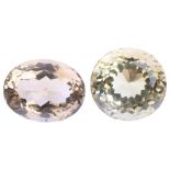 2 unmounted gemstones, comprising round-cut citrine, 16.8 x 13.3mm, and oval smoky quartz, 18.7 x