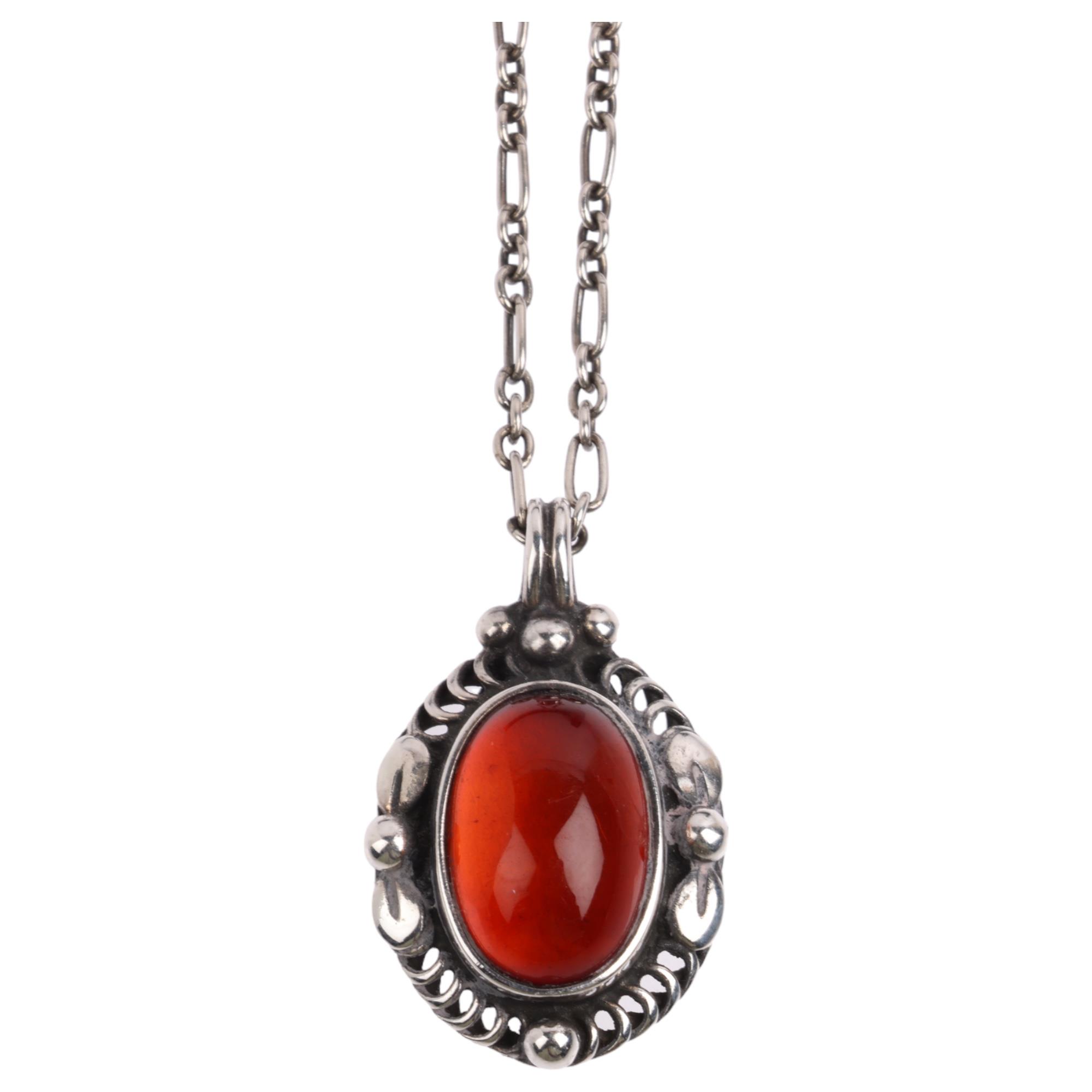 A Danish modernist sterling silver and amber Pendant Of The Year 1995 necklace, on original sterling