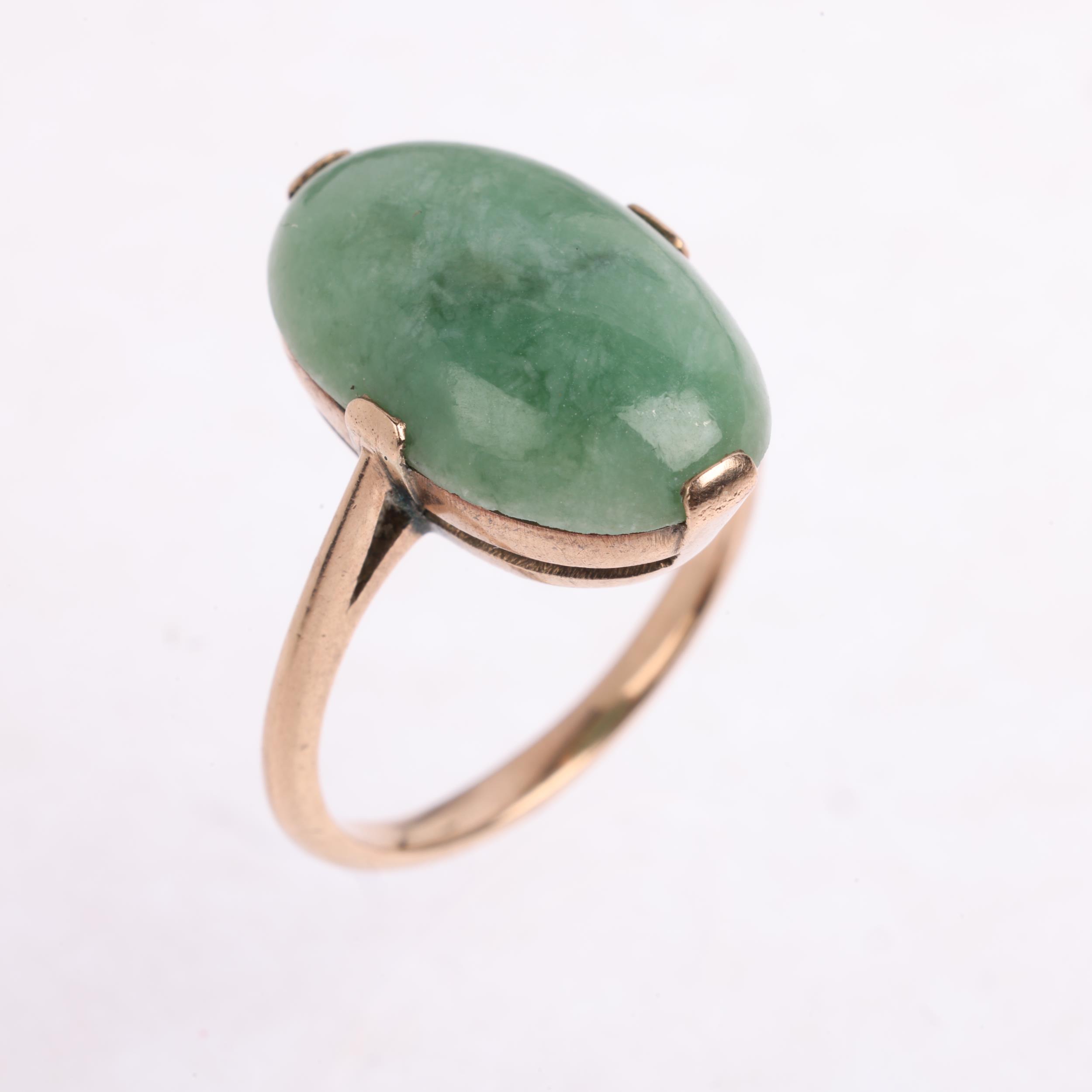 A late 20th century jadeite panel ring, claw set with oval cabochon jadeite, apparently unmarked, - Image 2 of 4