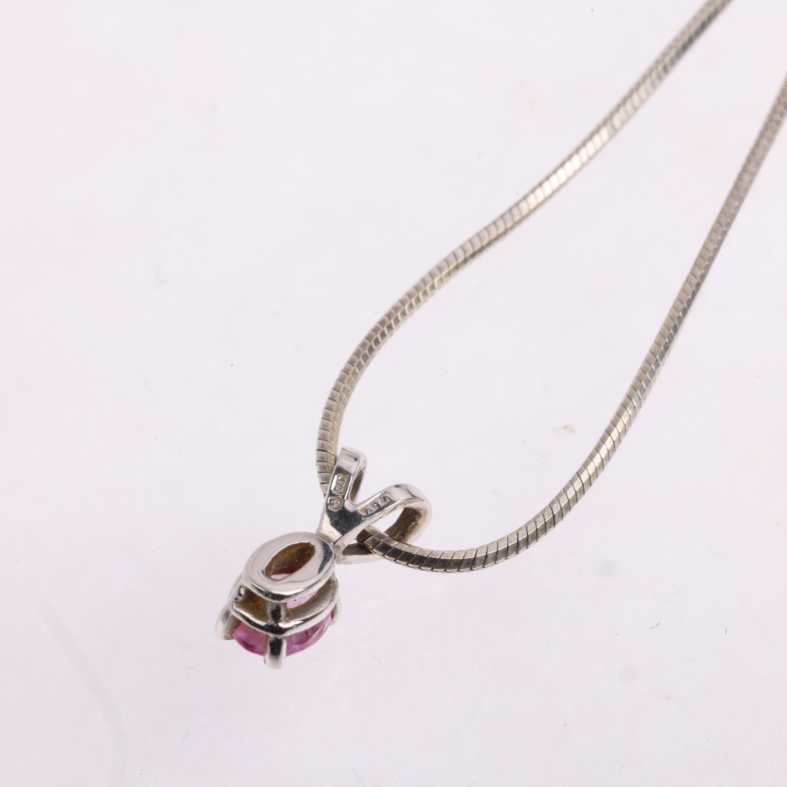 A 9ct white gold pink sapphire pendant necklace, on 9ct herringbone link chain, pendant 10.9mm, - Image 3 of 3