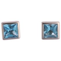 A pair of blue topaz earrings, rub-over set with Princess-cut topaz, stud fittings, apparently