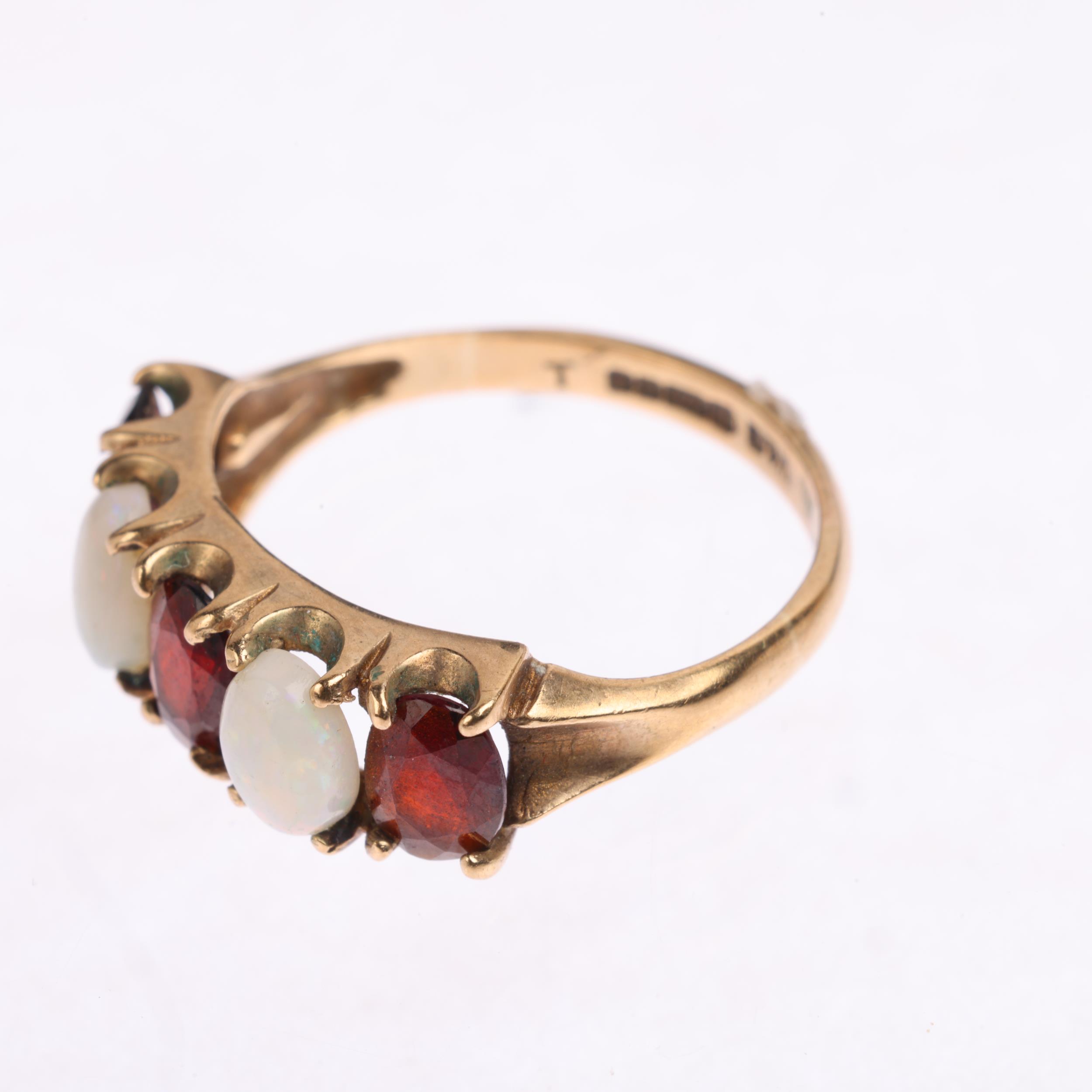 A 9ct gold five stone opal and garnet half hoop ring, maker W&G, Birmingham 1975, setting height 6. - Image 3 of 4