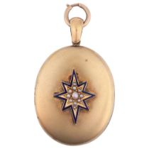 A Victorian split pearl and blue enamel star photo locket pendant, circa 1880, oval form with