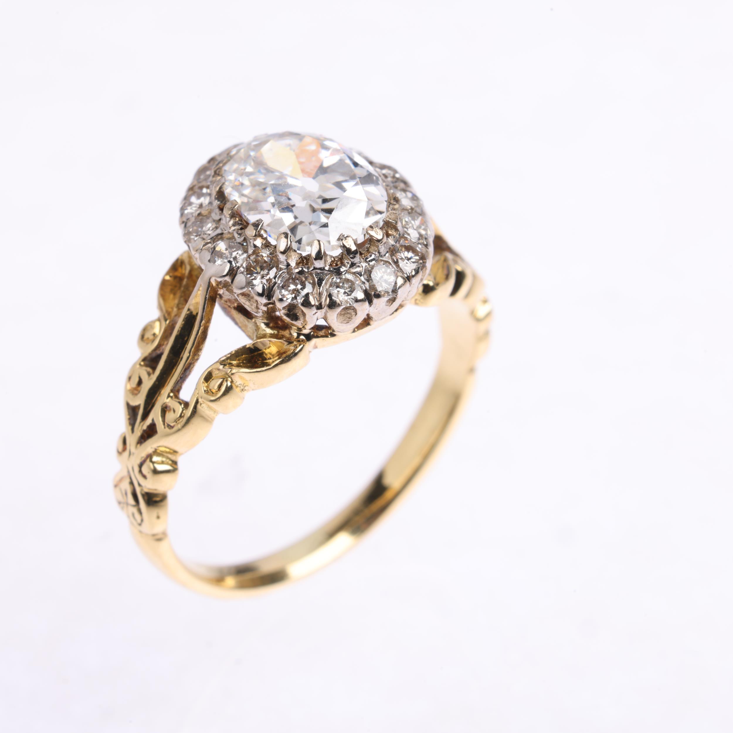 An 18ct gold 1.35ct lab grown diamond cluster ring, centrally claw set with 1.3ct oval mixed-cut lab - Image 2 of 4