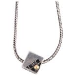 JENS JOHS AAGAARD - a Danish modernist sterling silver-gilt cube openwork pendant necklace, on