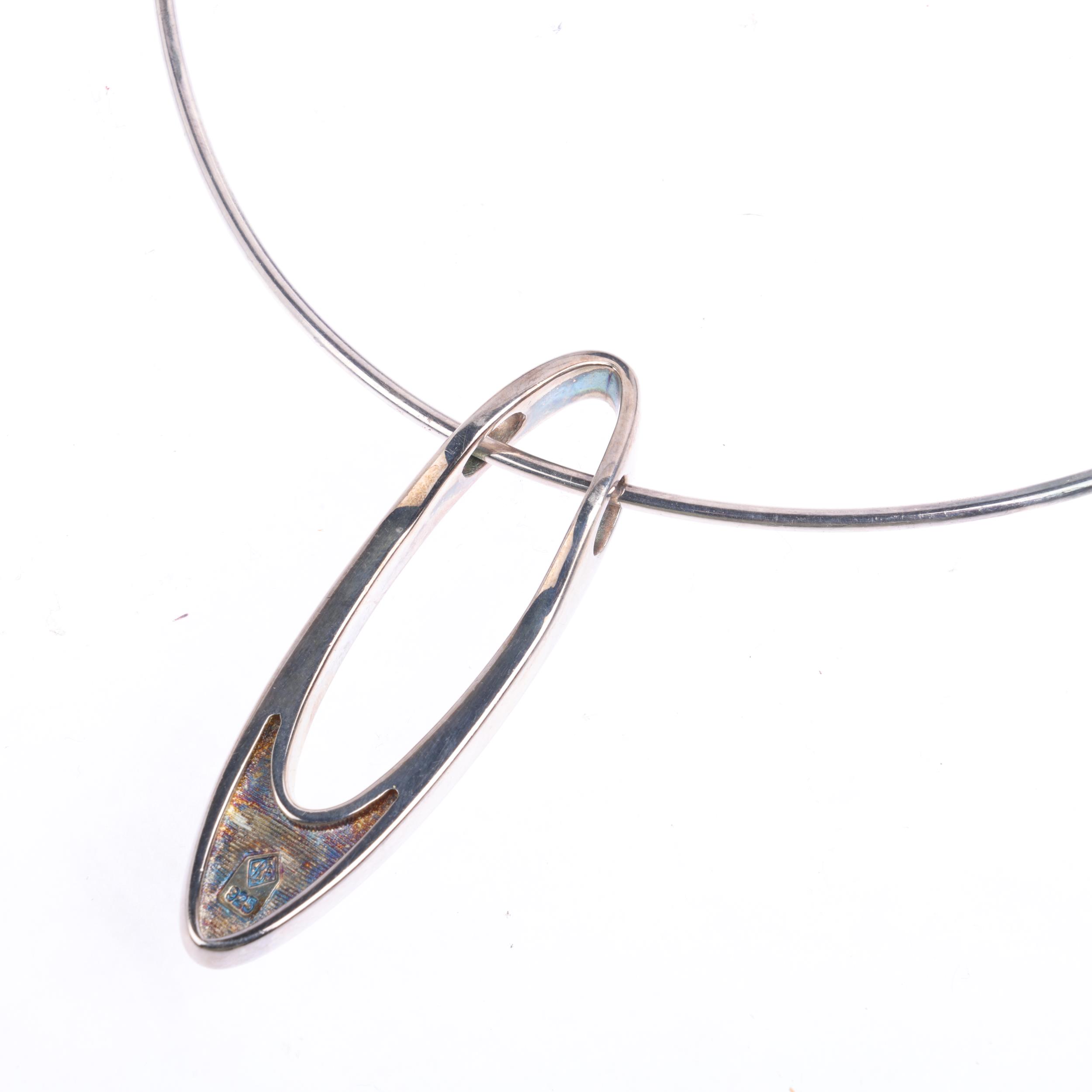 A sterling silver ellipse openwork pendant necklace, maker RS, on sterling neck torque, pendant 59. - Image 3 of 3